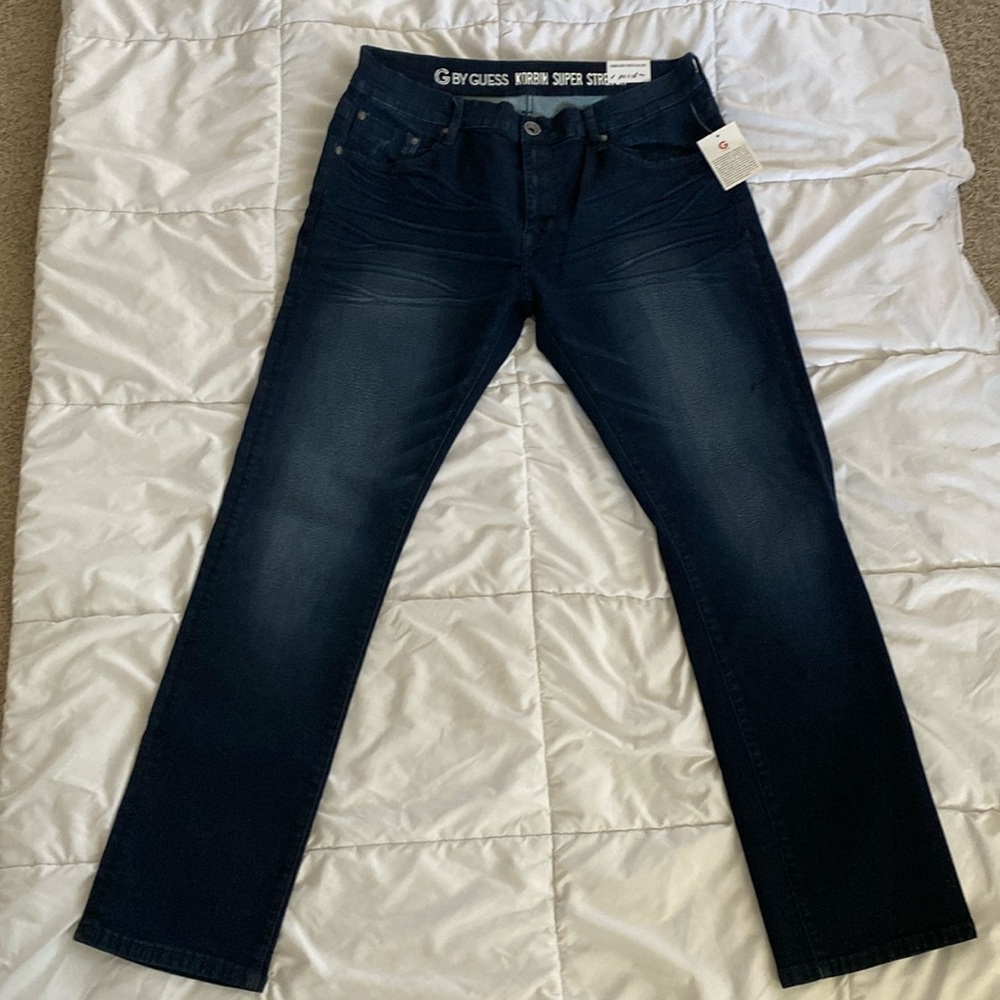 Brand new, never worn dark wash denim jeans by Guess